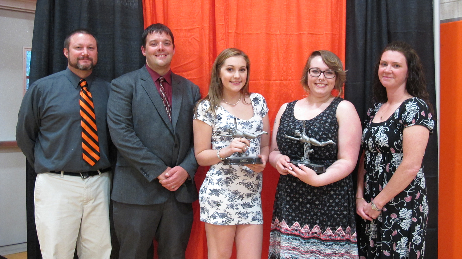 Girls Swimming and Diving: Jessie Faulkner (center left), Courtney McDermot (center right). Presented by: Kevin Upcraft an Girls Swimming and Diving: Jessie Faulkner (center left), Courtney McDermot (center right). Presented by: Kevin Upcraft an